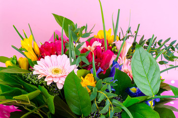 Beautiful bouquet of flowers on pink background