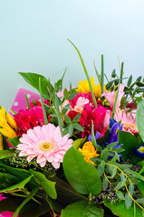 luxurious bouquet of fresh flowers on mint background