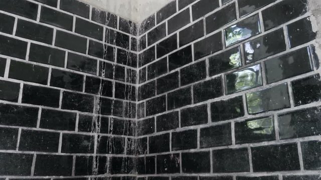 View of old shower tile, day lighting. Slider equipment used
