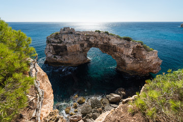 Es Pontas, a natural rock arch off the coast of Cala Santanyi, Mallorca, Balearic Islands, Spain