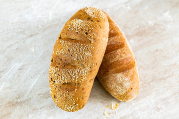 Italian bread on white marble background. Fresh homemade bread bakery