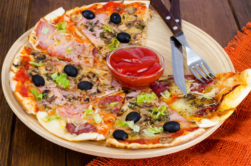 Six slices of pizza with different toppings on wooden board