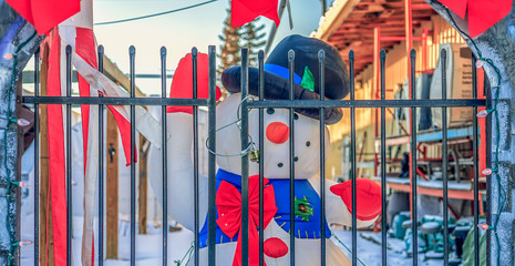Fototapeta na wymiar Frosty the Snowman Behind Bars