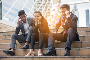 Stressful businessmen on the stairs