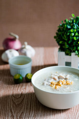 ox tripe congee or also known as goto best topped with fried garlic and calamansi juice