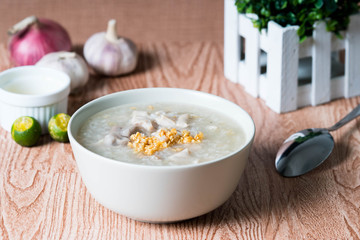 ox tripe congee or also known as goto best topped with fried garlic and calamansi juice