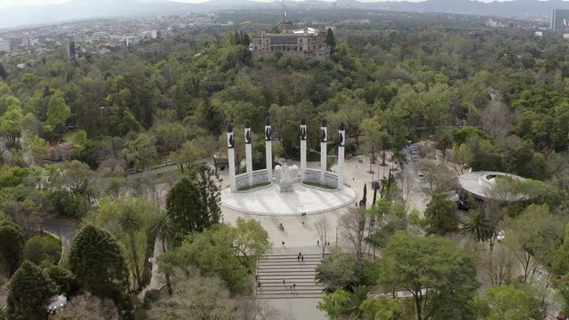 Mexico City Chapultepec Park 4k Aerial Drone of Ni&ntilde;os H&eacute;roes Statues and Reveal of Castle Surrounded by Thick Forest in Dense Urban City