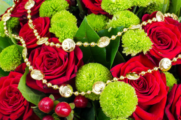 Bouquet of flowers and colored beads for Mardi gras © ArtCookStudio