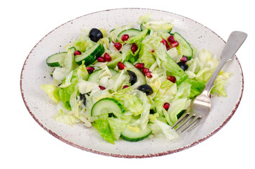 Weight loss. Dietary salad with fresh vegetables and pomegranate seeds