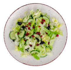Weight loss. Dietary salad with fresh vegetables and pomegranate seeds