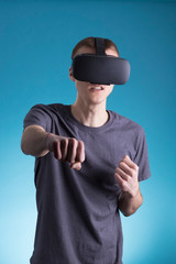 Young man using VR Virtual Reality headset