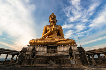 Big Golden Buddha with blue sky, Phetchaburi, Thailand.