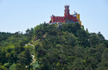 Pena Palace on the top of Sintra Mountains as seen from the Moorish castle. Sintra. Portugal
