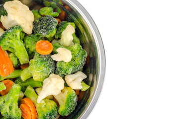 Mix of frozen vegetables in metal bowl