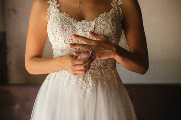 hands of bride with wedding rings on a wedding day