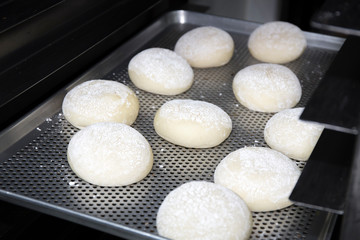 Fototapeta na wymiar Baking doughnuts in a commercial kitchen