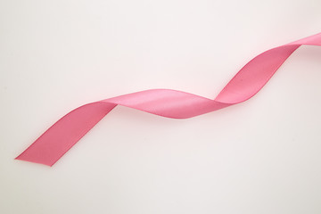 Curled Pink Ribbon On White