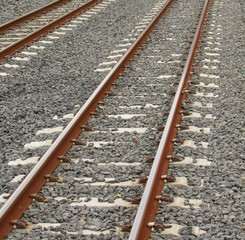 Naklejka premium train tracks side by side railway lines medium closeup shot