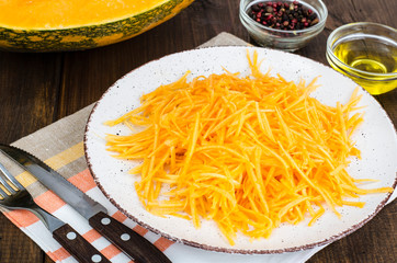 Vegetarian salad of fresh organic pumpkin, raw food