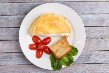 tomatoes cherry and beaten eggs, top view