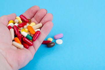 Different medical capsules, pills on palm.Concept of health protection