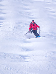 People are enjoying mogul skiing snow boarding