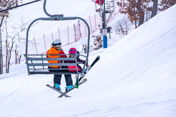 Fototapeta na wymiar People are enjoying skiing / snowboarding
