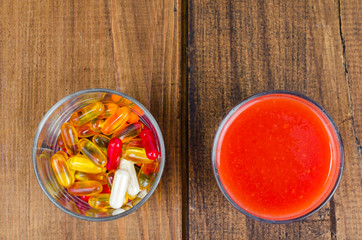 Concept of healthy lifestyle and diet. Fruits, vegetables, juices, pills and vitamin supplements