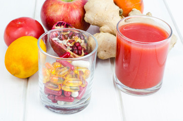 Concept of healthy lifestyle and diet. Fruits, vegetables, juices, pills and vitamin supplements