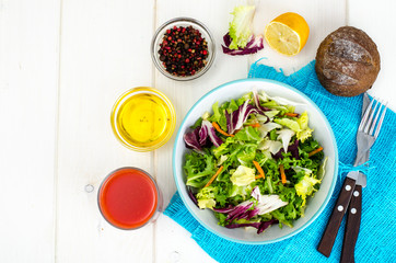 Salad from mix of herbs (iceberg, radiccio, friis, romance, carrot, arugula). Vegetarian, vegan concept