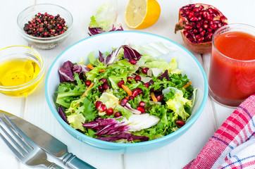 Fresh green salad with pomegranate, vegetarian menu