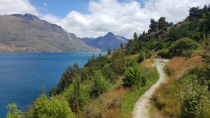 This photo is taken in New Zealand. It was a beautiful day for a day hike around a blue lake. The scenery is amazing.