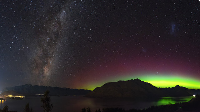 Aurora in New Zealand. Night sky image of southern lights and milky way galaxy in New Zealand