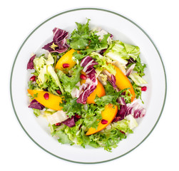 Salad with green leaves and persimmon