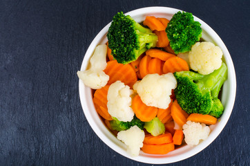 Boiled carrots, broccoli, cauliflower, vegetarian food ingredients. Healthy lifestyle concept