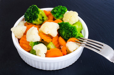 Boiled carrots, broccoli, cauliflower, vegetarian food ingredients. Healthy lifestyle concept