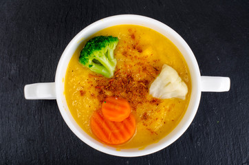 Vegetable soup puree on  black background