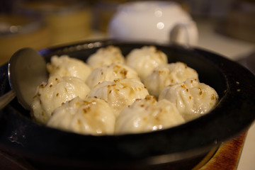 Steamed stuffed chinese buns in Bamboo Steamer. Traditional chinese food. Chinese delicacy.