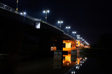 Phaya mengrai bridge road on Thanon Klang Wiang street crossover Kok River in night time at Chiangrai city in Chiang Rai, Thailand