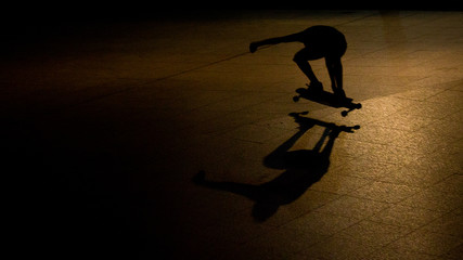 Shadow of a skateboarder taken at night. Using spot light, I was able to shoot his elongated shadow.