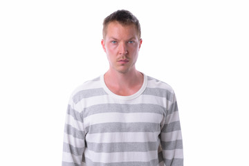 Fototapeta premium Young handsome man isolated against white background