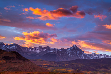 Dramatic sunrise over the Dallas Divide in Colorado's San Juan Mountains - obrazy, fototapety, plakaty