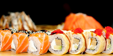 beautiful sushi, rolls, with caviar and fresh fish, close-up