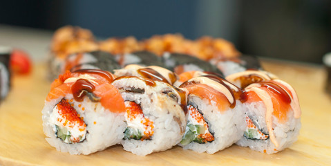beautiful sushi, rolls, with caviar and fresh fish, close-up