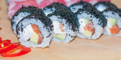 beautiful sushi, rolls, with caviar and fresh fish, close-up