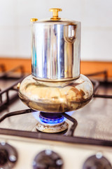 Italian coffe cooker on gas stove, breakfast