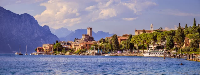 Foto op Canvas Idyllic coast in Italy: Blue water and a cute village at lago di garda, Malcesine © Patrick Daxenbichler