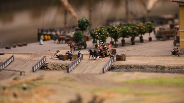 coachman drives an old carriage drawn by a pair of horses, the bridge barrier opens, animation