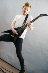 Fototapeta premium Man playing on electric guitar
