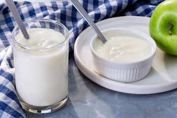 Yogurt and fruit is a healthy breakfast. Yogurt made from milk fermented by added bacteria, often sweetened and flavored.